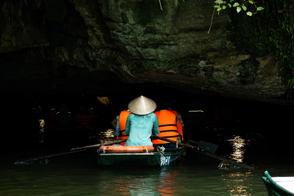 Sailing inside Trang An Grottoes