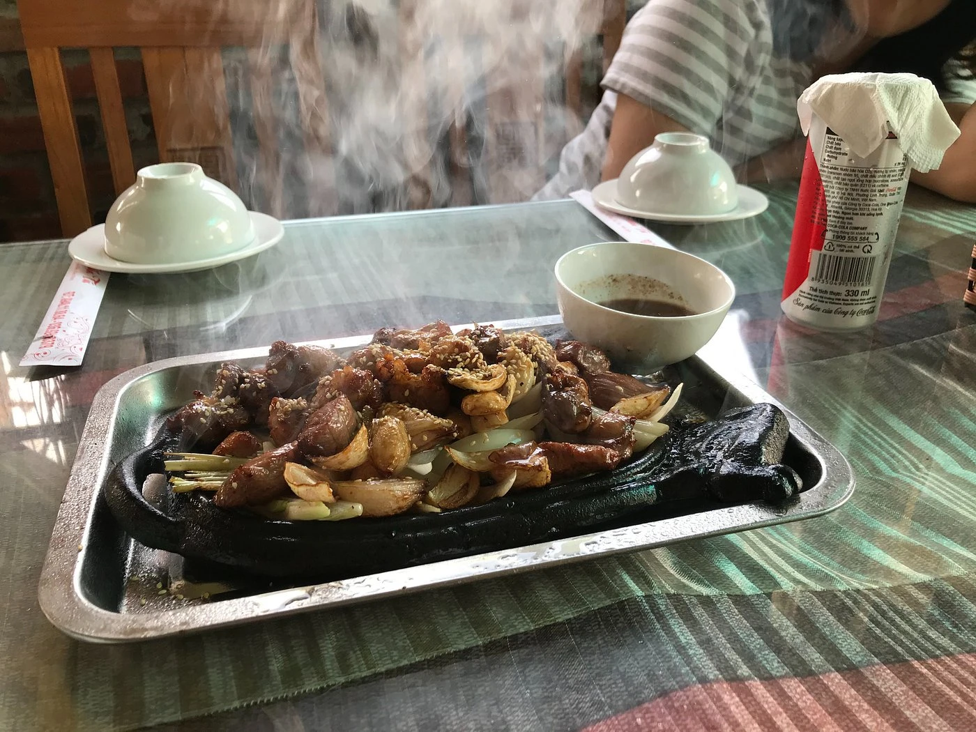 Goat meat in iron tray, a signature in Tuan Tu Restaurant