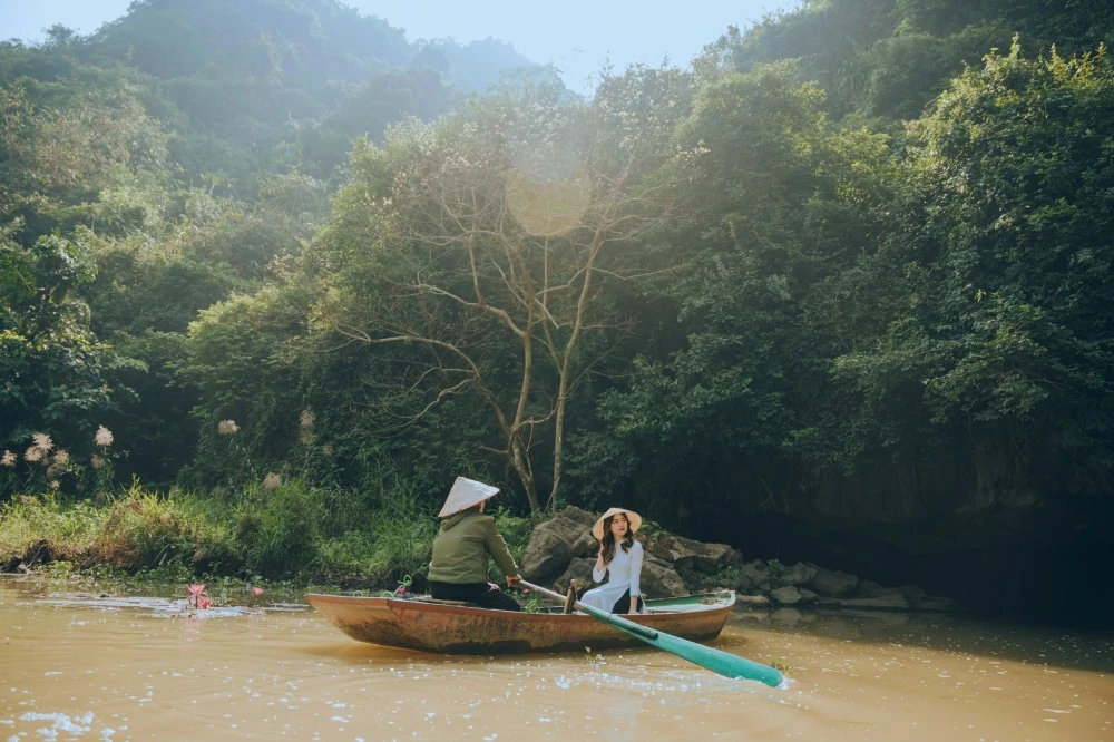 Tourists on boat exploring Bird Valley Ninh Binh