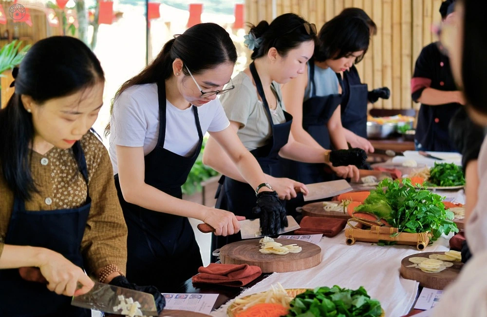 Travelers making dishes during Ninh Binh Cooking Class