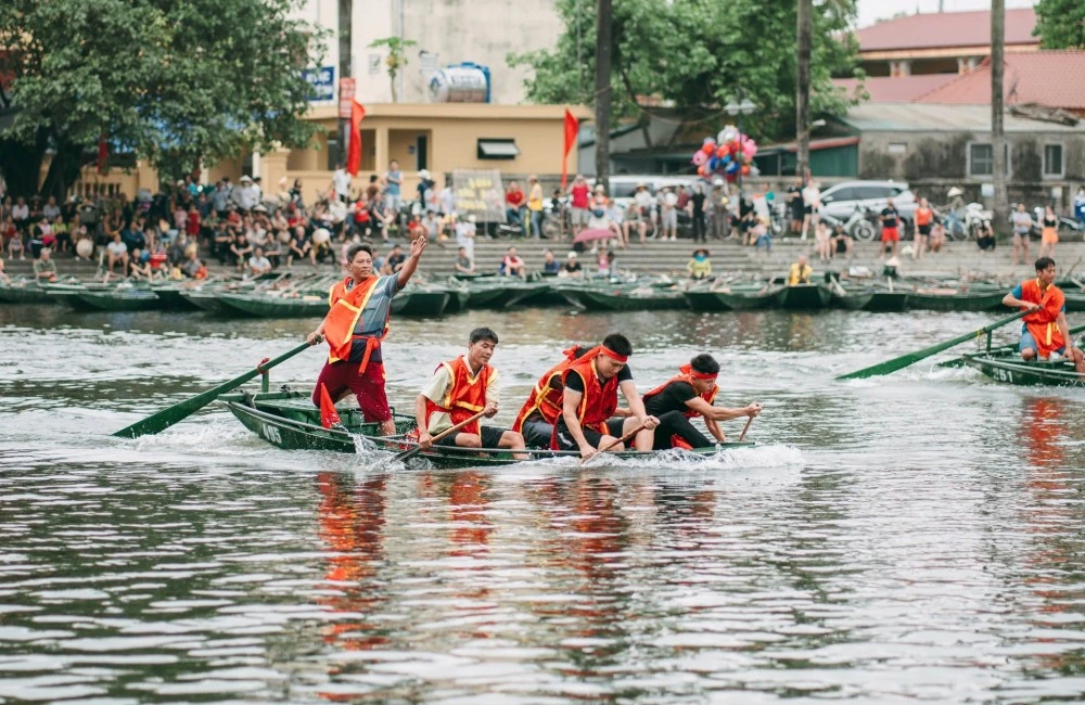Riding boat during a festival in Ninh Binh